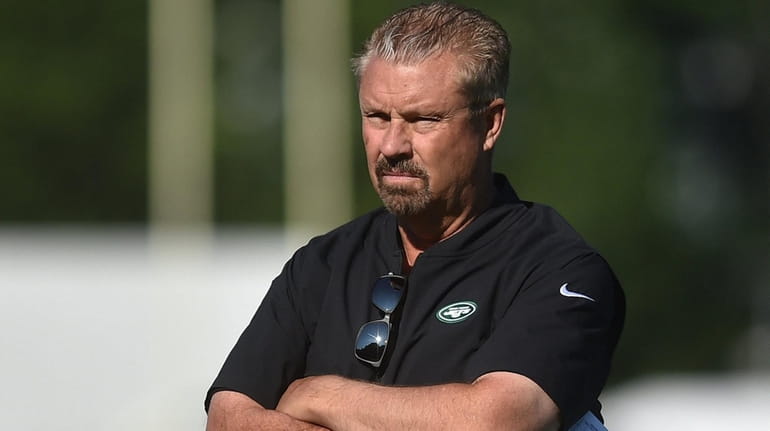 Jets defensive coordinator Gregg Williams watches his players during training...