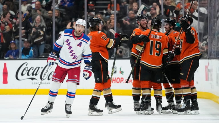 Anaheim Ducks celebrate a goal by Troy Terry as New...