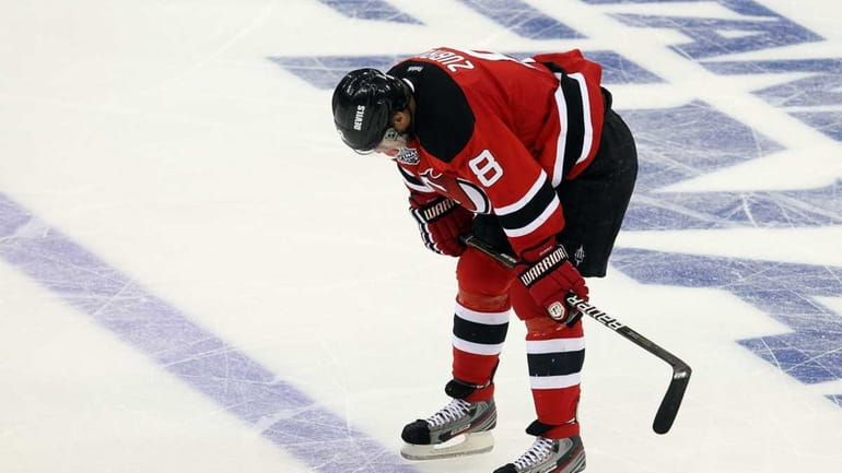Dainius Zubrus reacts after the Devils lost in overtime to...