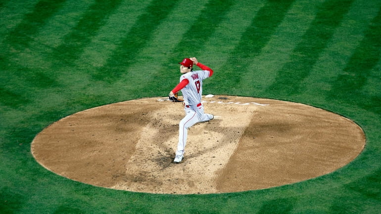 Los Angeles Angels' Shohei Ohtani throws against the Oakland Athletics...