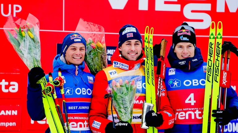 Winner Jarl Magnus Riiber of Norway, center, second placed Johannes...