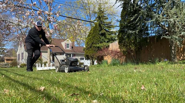 Michael Lindner, 17, has been cutting grass for free for health...