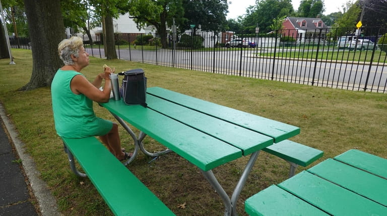 Careen O'Connor, of Merrick, eats her lunch at Veterans Memorial...