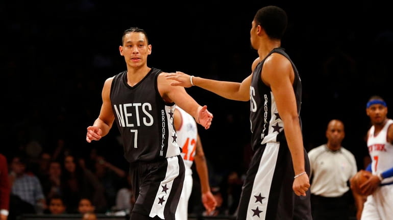 Jeremy Lin #7 of the Brooklyn Nets reacts after a...