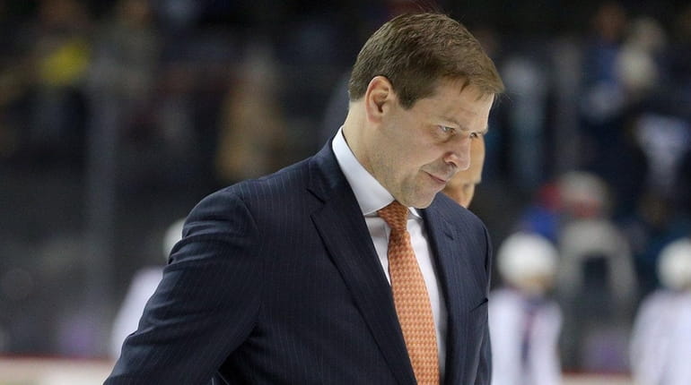 Islanders head coach Doug Weight leaves the ice after losing...