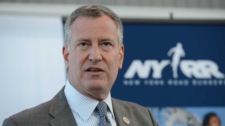 New York City mayor Bill de Blasio talks during a...
