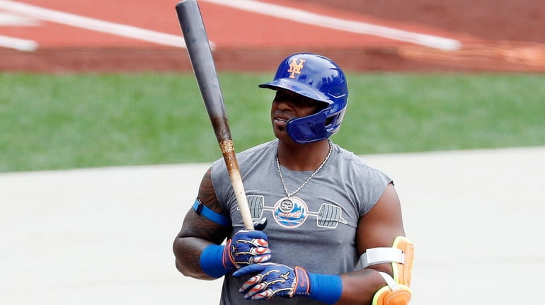 Yoenis Cespedes gets ready to hit during Mets camp at...