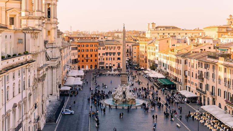 Rome skyline and Piazza Navona at sunset in Lazio, Italy.