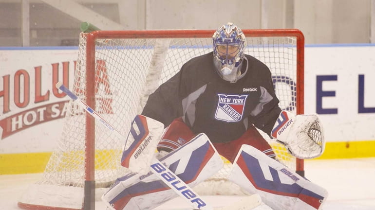 New York Rangers goaltender Henrik Lundqvist practices at the team's...