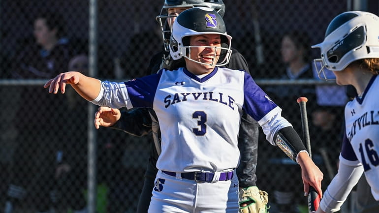 Isabella Lundquist of Sayville crosses home plate putting Sayville within...