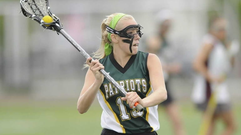 Ward Melville's Kim Geiger looks to pass against Bay Shore....