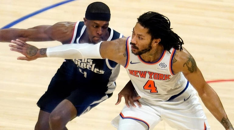 Knicks guard Derrick Rose, right, is defended by Clippers guard...