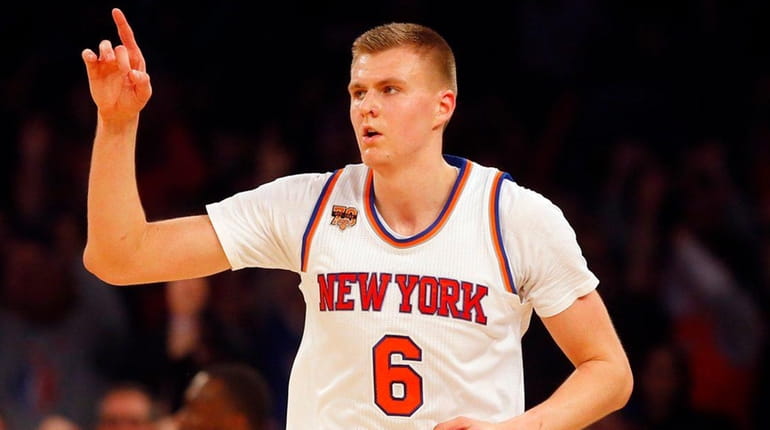 Kristaps Porzingis of the New York Knicks reacts after hitting...