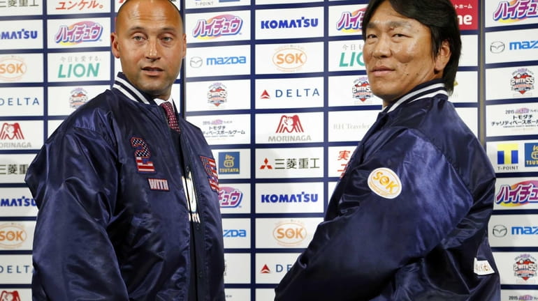Former Yankees Derek Jeter, left, and Hideki Matsui pose for...