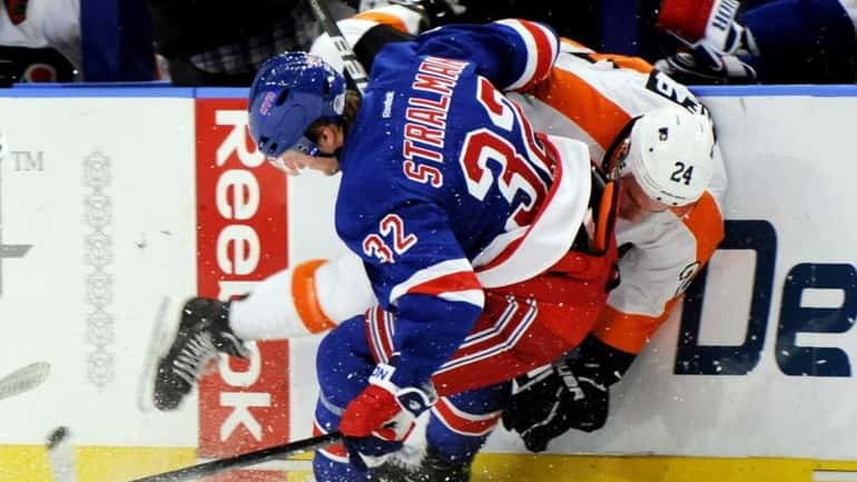 New York Rangers' Anton Stralman checks Philadelphia Flyers' Matt Read...