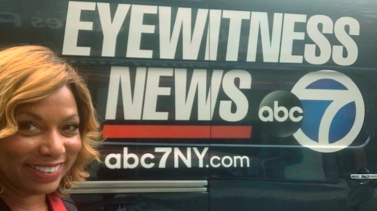 Rolonda Watts poses by ABC 7 's Eyewitness News van,...