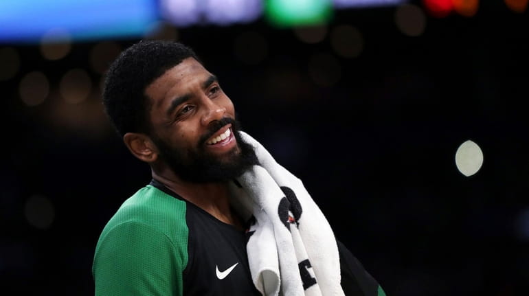 Kyrie Irving has many reasons to smile, choosing to play...