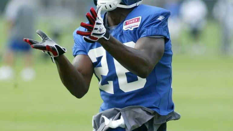Giants' defender Antrel Rolle pulls down a pass during defensive...