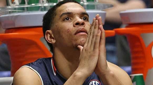 Auburn's Tyler Harris sits on the bench during the second...