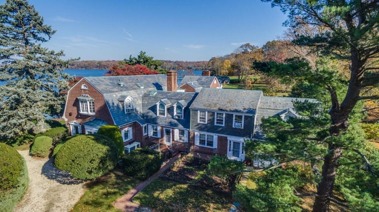 This circa 1950 brick home in Oyster Bay Cove is...
