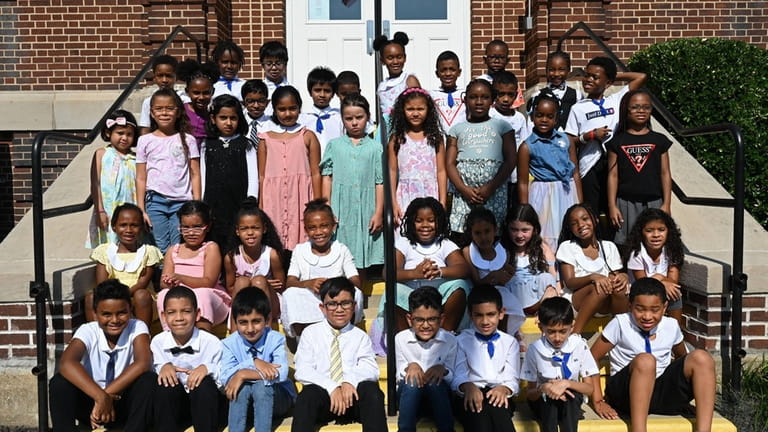 Second-graders at Clear Stream Avenue School re-create a photo taken...