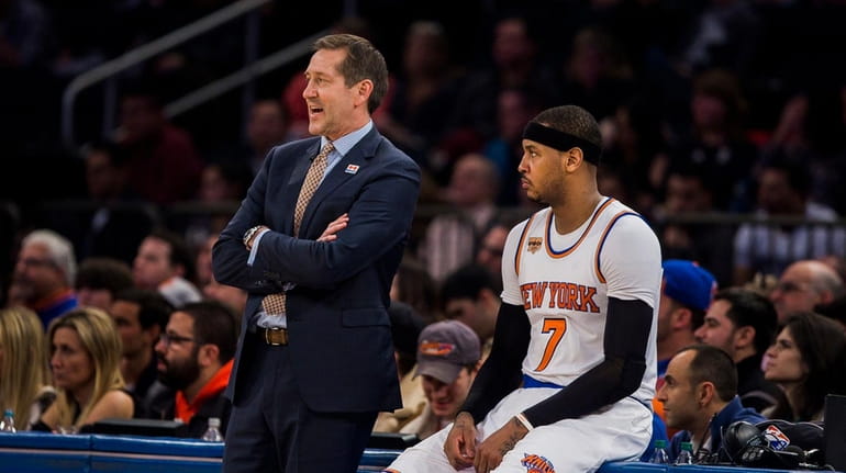 New York Knicks coach Jeff Hornacek, left, talks to Carmelo...