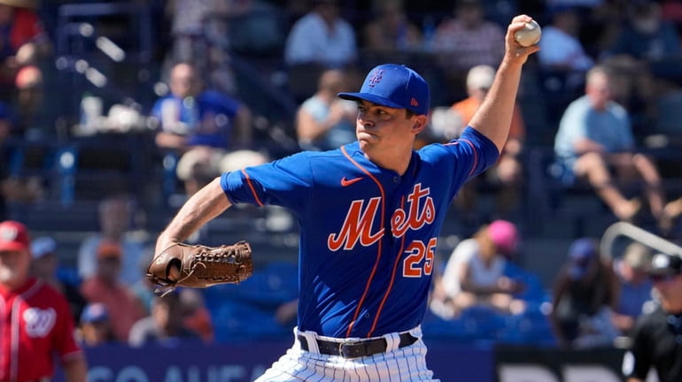 Mets pitcher Brooks Raley throws during the third inning of...