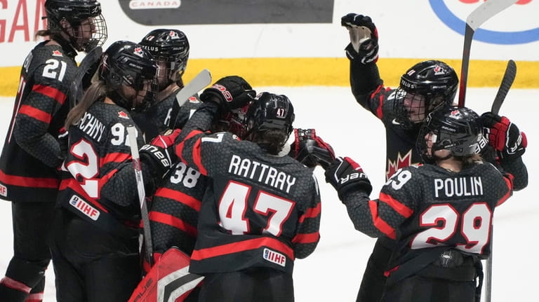 Canada celebrates a win over Sweden in a quarterfinal at...