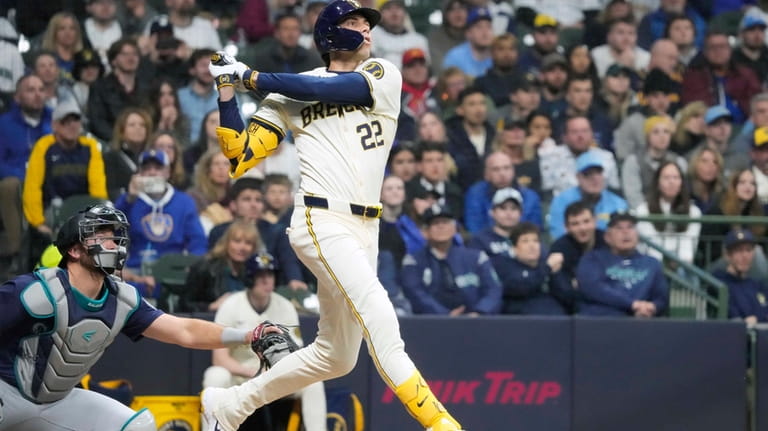 Milwaukee Brewers outfielder Christian Yelich (22) hits a home run...