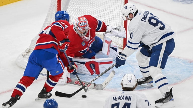 Toronto Maple Leafs' John Tavares (91) moves in on Montreal...