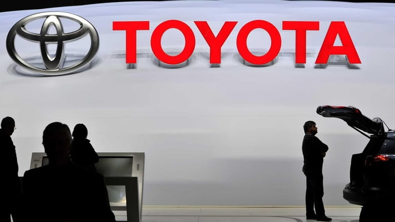A visitor inspect a Toyota SUV during the 83rd Geneva...