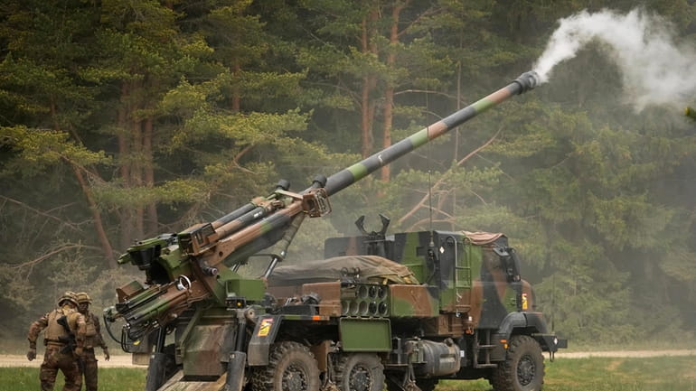 French soldiers fire a French-made CAESAR self-propelled howitzer during the...