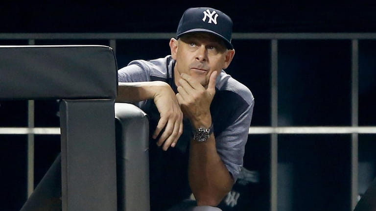 Yankees manager Aaron Boone looks on during the ninth inning against...