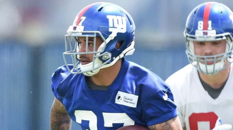 New York Giants safety Darian Thompson runs with the football...