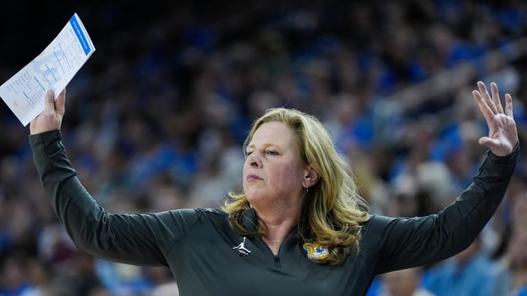 UCLA coach Cori Close gestures during the first half of...