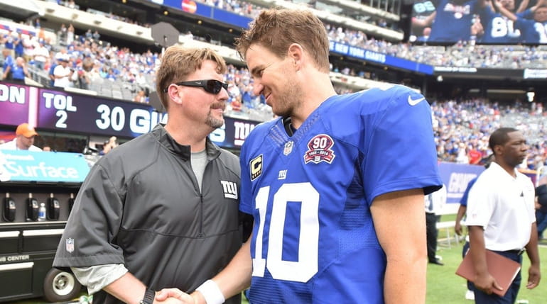 New York Giants quarterback Eli Manning (10) shakes hands with...