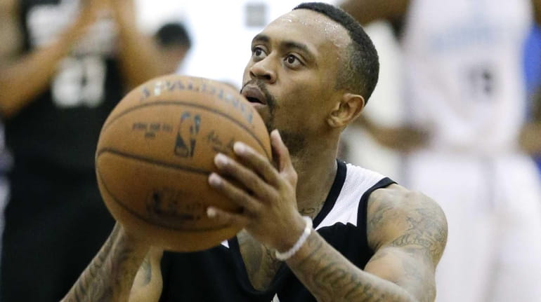 Brooklyn Nets' Ryan Boatright shoots against the Charlotte Hornets during...