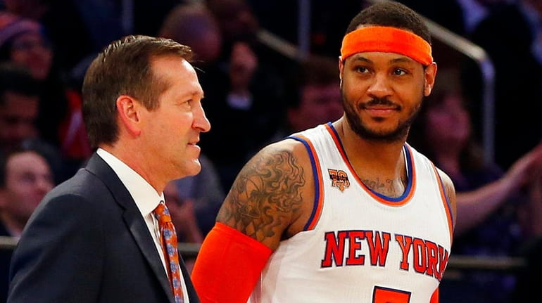 Carmelo Anthony of the New York Knicks stands with head...