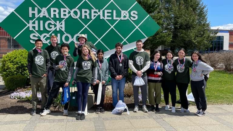 Teams from Harborfields High School in Greenlawn placed first and...