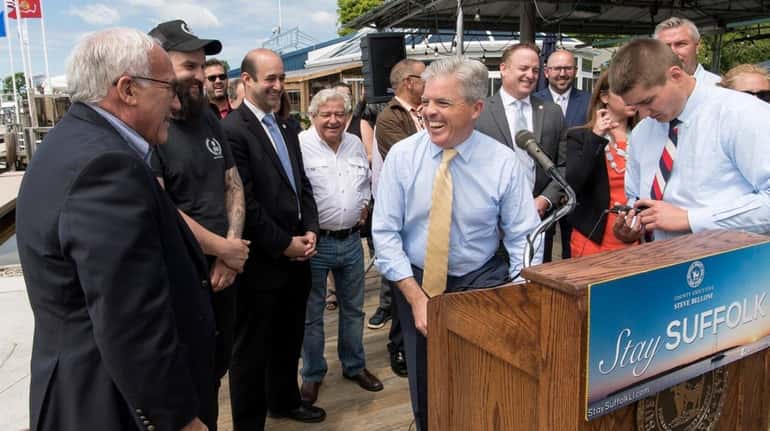 Suffolk County Executive Steve Bellone shared a laugh with Patchogue...