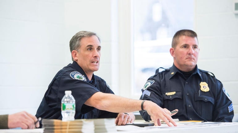 East Hampton Town Police Chief Michael Sarlo, left, addresses a...