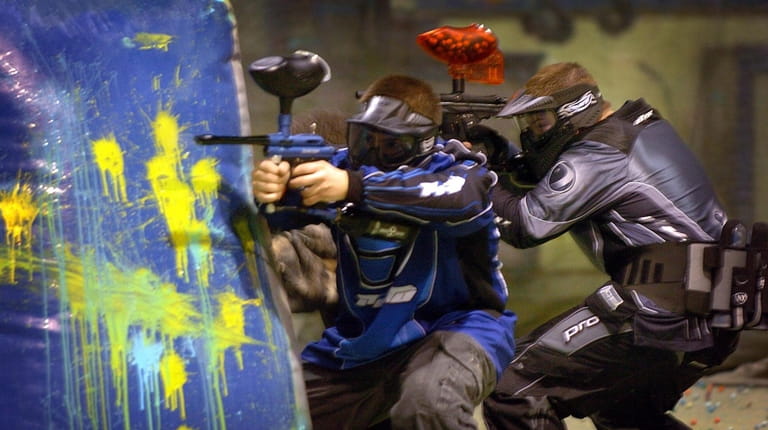 Players compete in a game of Paintball at Cousins Paintball. 