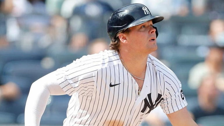 Luke Voit of the Yankees follows through on his fifth-inning two-run...