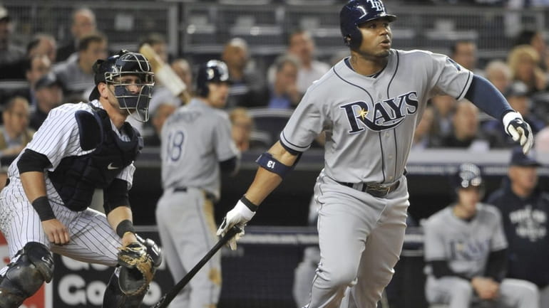 Rays' Carl Crawford hits an RBI double in the fourth...
