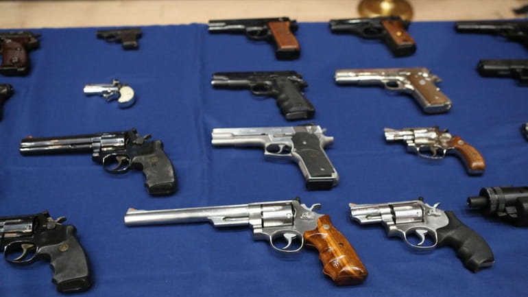 Guns seized during a raid in Queens in 2018.