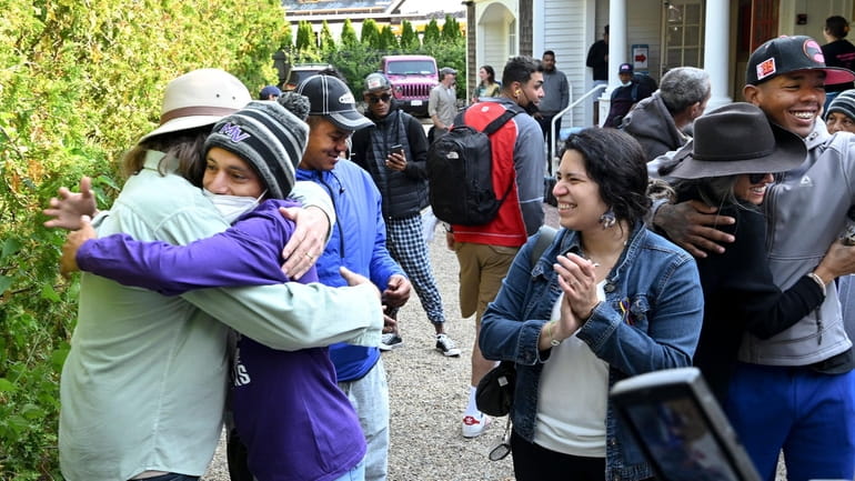 Carlos Munoz hugs Larkin Stallings of Vineyard Haven, Mass., as...