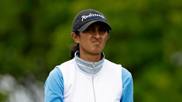 Aditi Ashok, of India, reacts while walking off the second...
