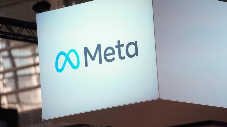 The Meta logo is seen at the Vivatech show in...