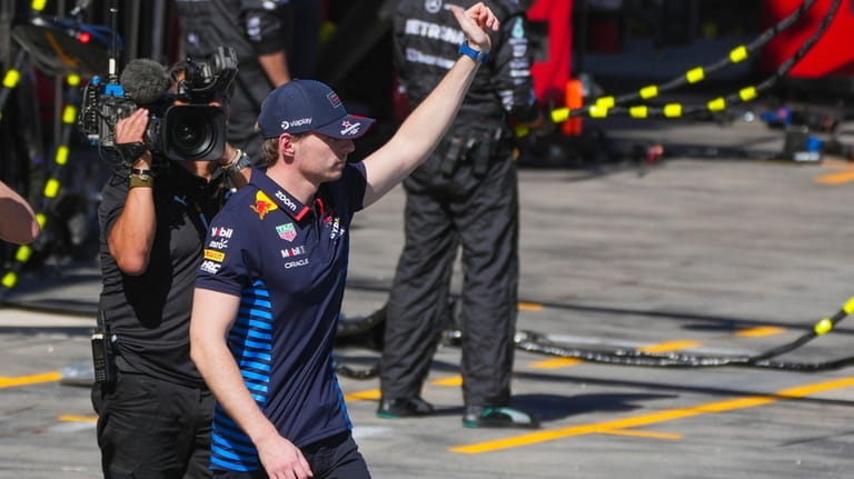Red Bull driver Max Verstappen of the Netherlands gestures to...