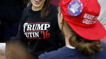 A woman wears a shirt reading 'Trump-Putin '16' before a...